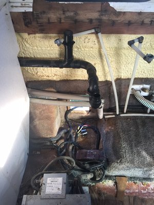 Shows area where sink cabinet was removed.  At least on this unit, there is no enclosed area for the electrical cord.  We will be blocking this off somehow.