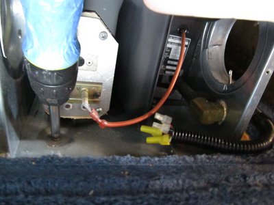 8 unscrew furnace from floor 2 screws at front base.jpg