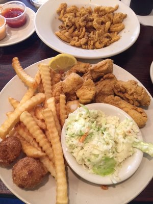 Fried oysters and scallops with a bowl of calamari